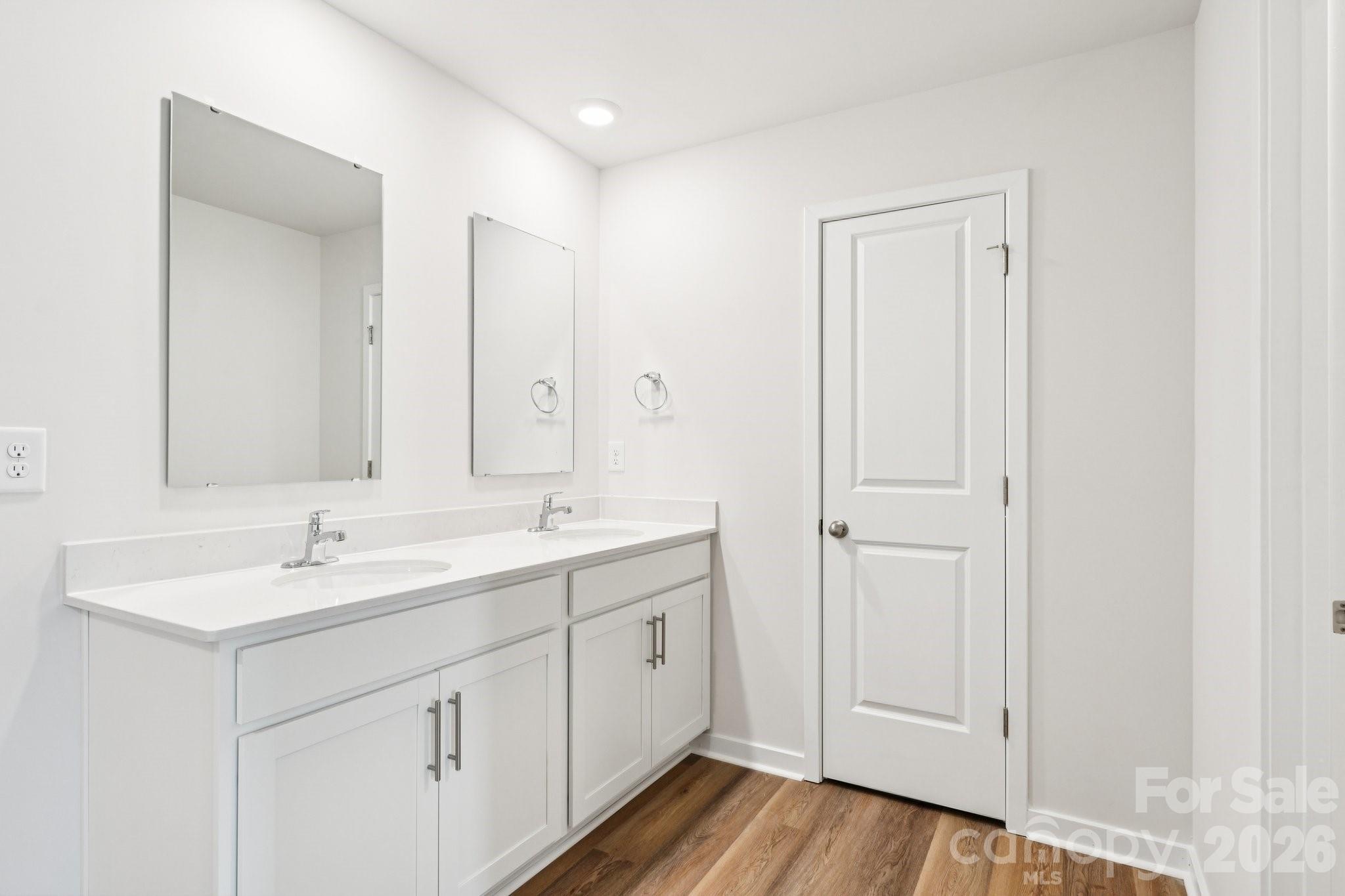 569 North Sparkleberry Street Chester, SC 29706 - Photo 29 of 40 a bathroom with a double vanity sink and mirror