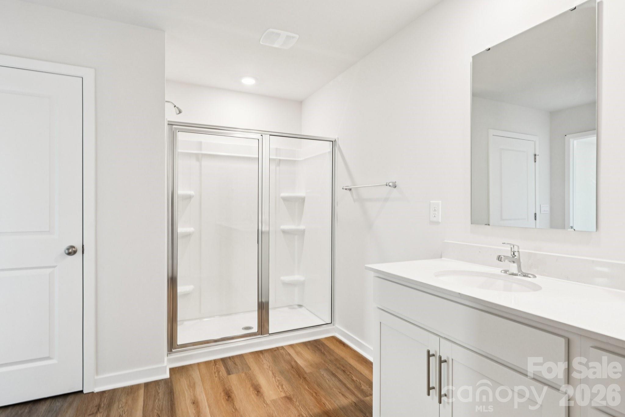 569 North Sparkleberry Street Chester, SC 29706 - Photo 30 of 40 a bathroom with a sink mirror and shower