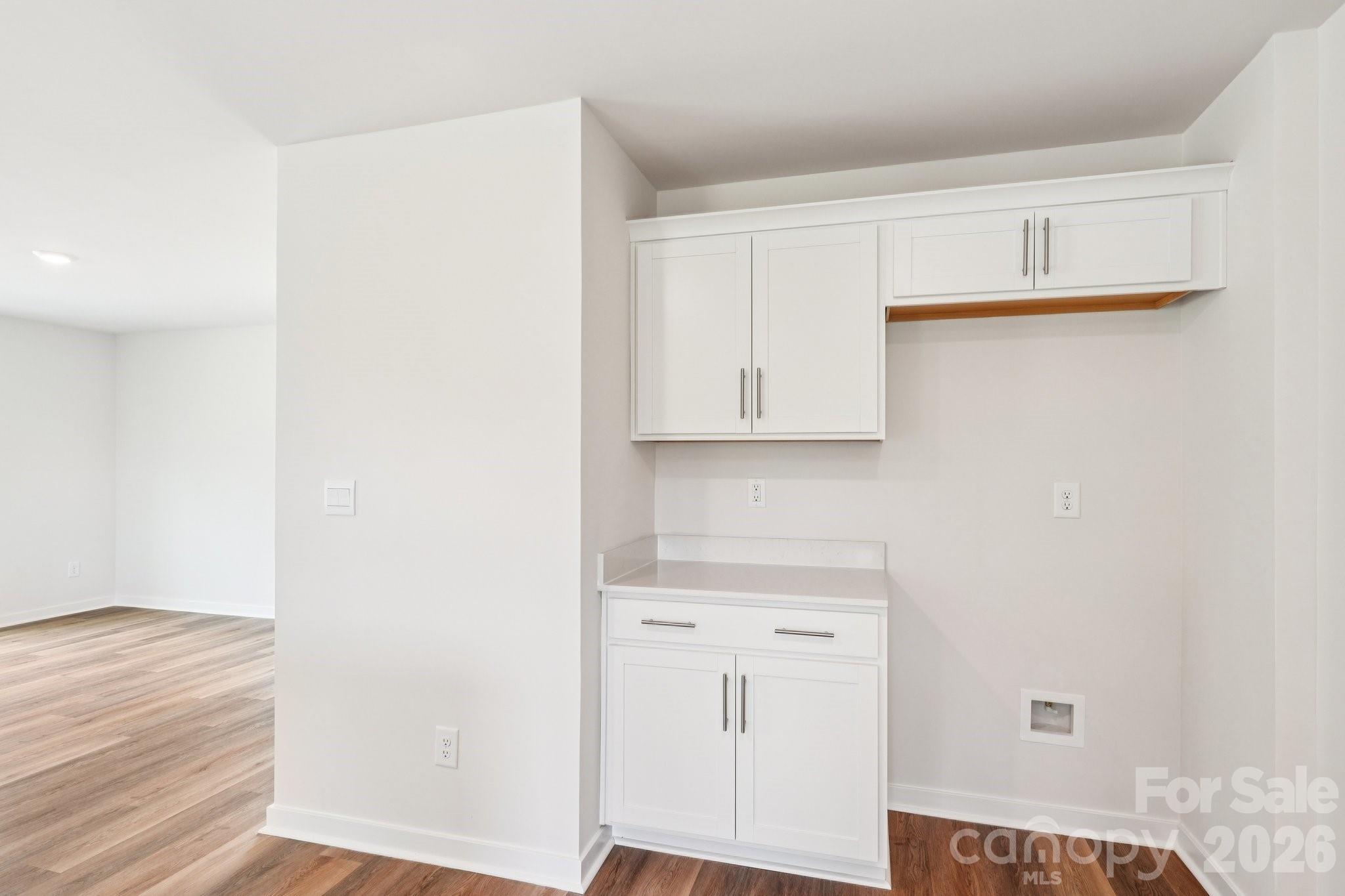 569 North Sparkleberry Street Chester, SC 29706 - Photo 9 of 40 a view of cabinets with wooden floor