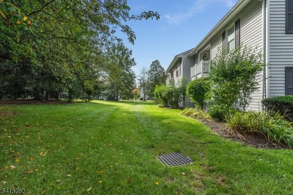 a view of an house with backyard space and garden