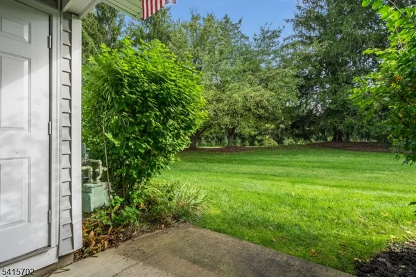a picture of a bench in front of a wall
