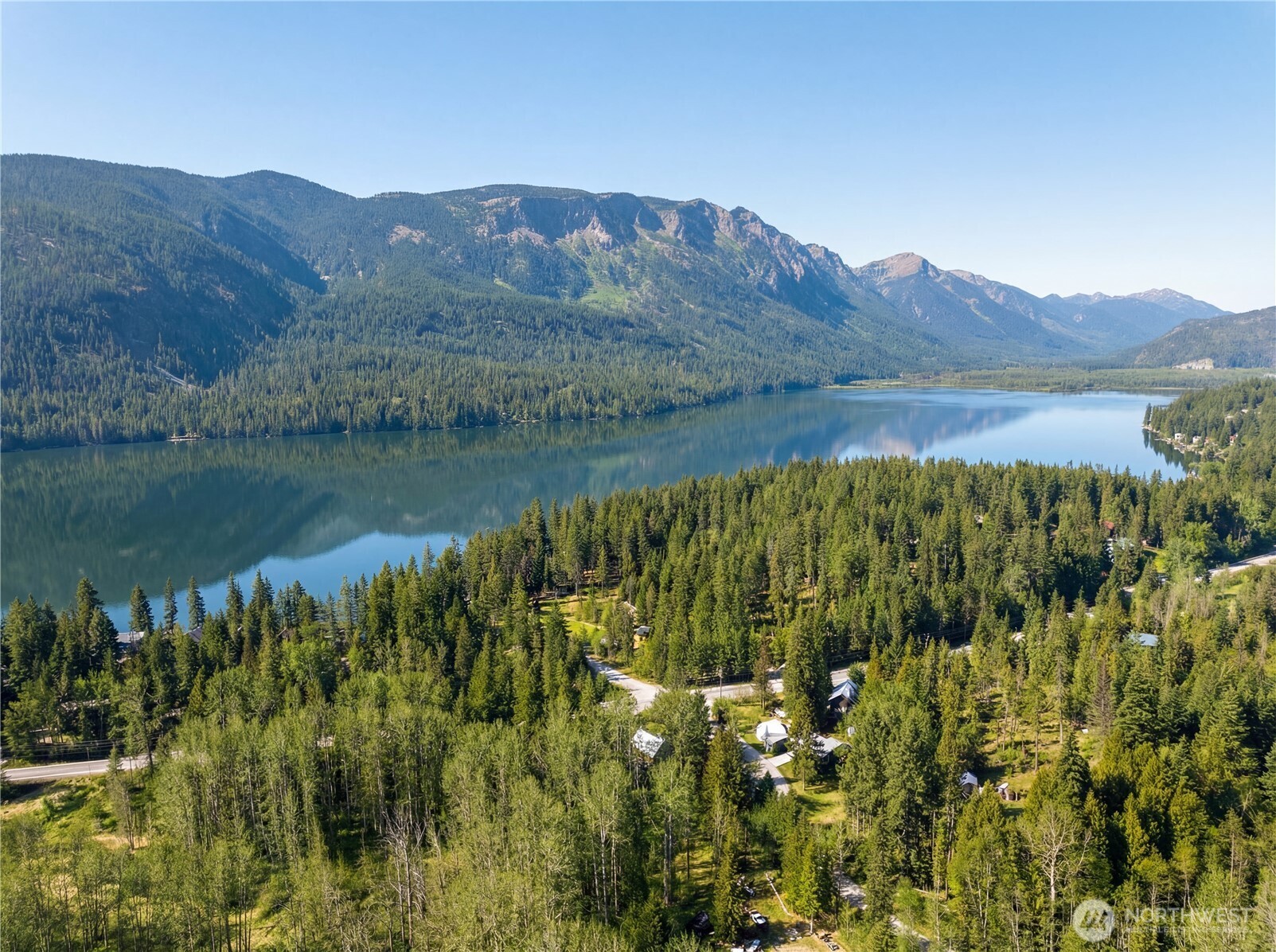 22740 Brown Road Leavenworth, WA 98826 - Photo 1 of 21 a view of a lake with a mountain in the background