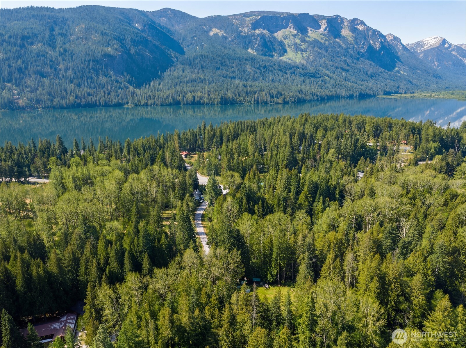 22740 Brown Road Leavenworth, WA 98826 - Photo 4 of 21 a view of a lush green hillside and a houses