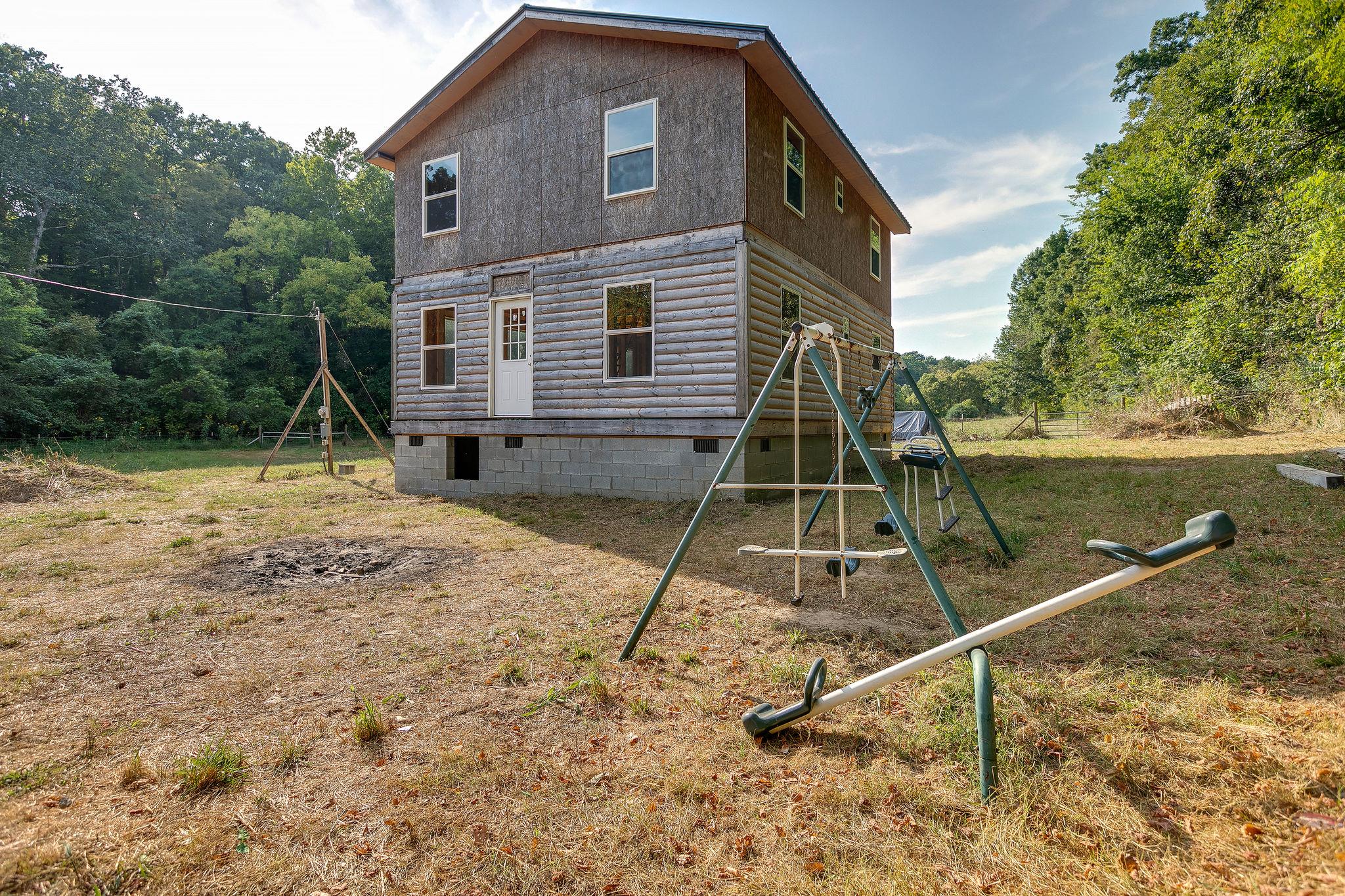 6572 Hassell Creek Road Lyles, TN 37098 - Photo 2 of 29 a house view with a backyard space