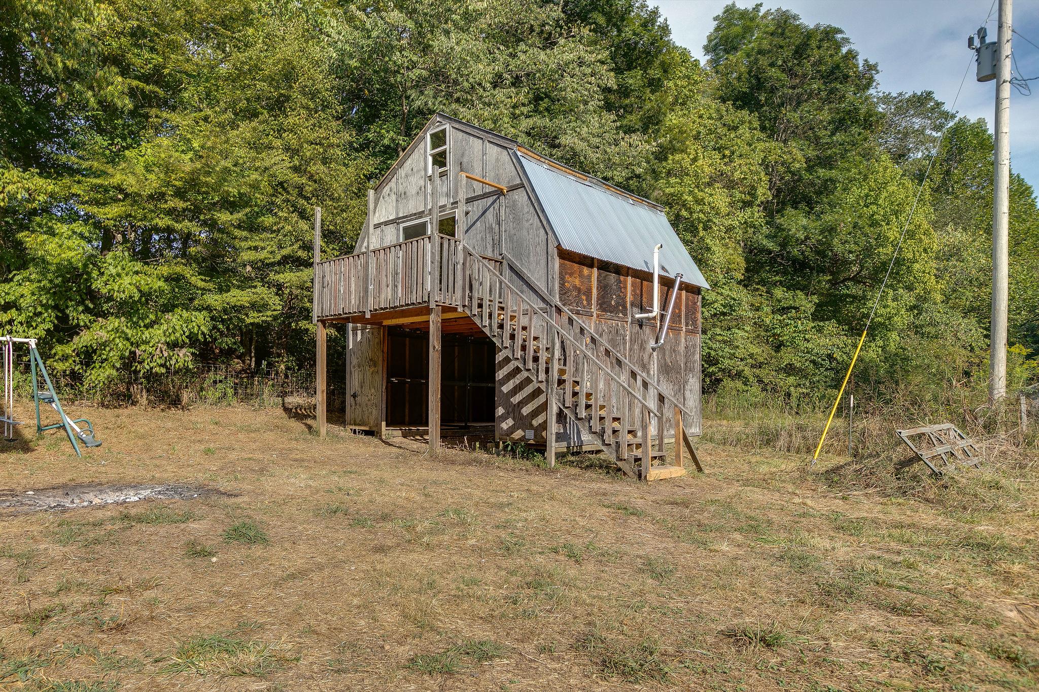 6572 Hassell Creek Road Lyles, TN 37098 - Photo 13 of 29 a view of wooden house with large trees