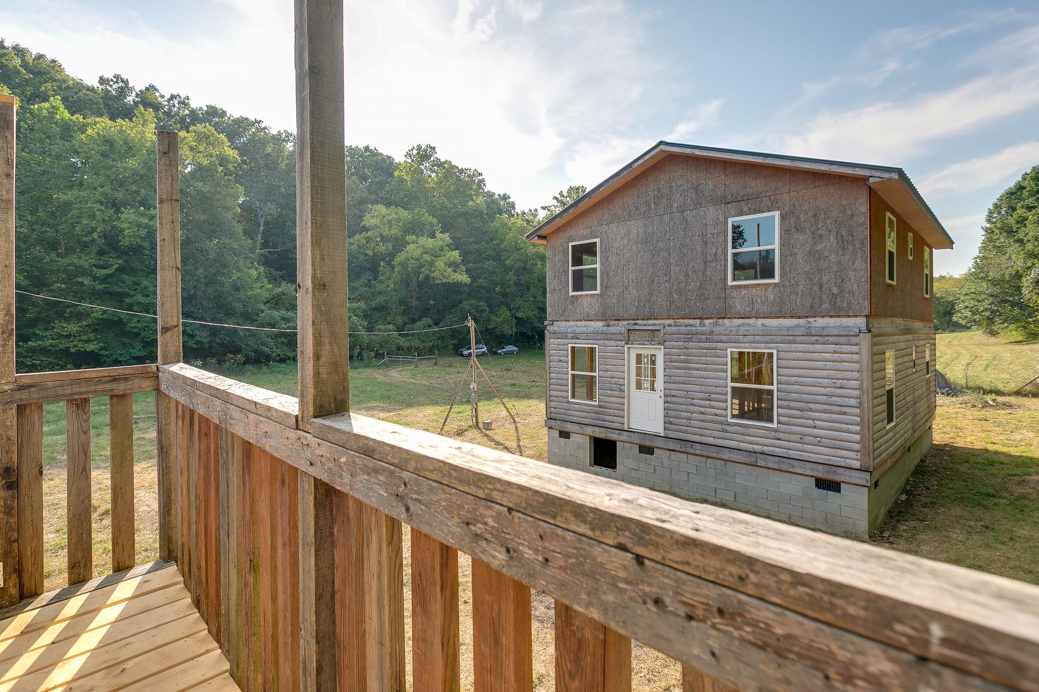 6572 Hassell Creek Road Lyles, TN 37098 - Photo 15 of 29 a view of a house with a balcony