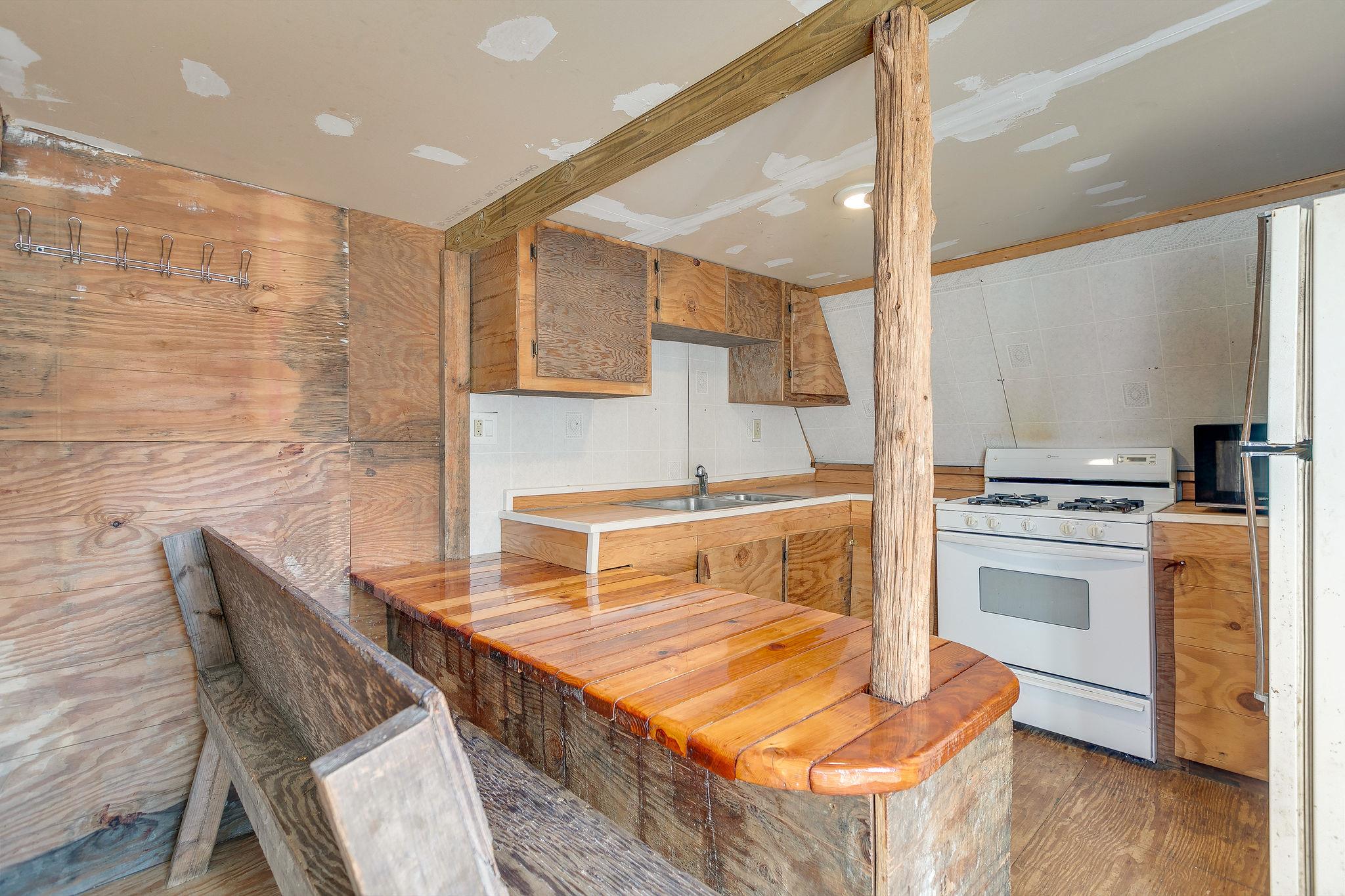 6572 Hassell Creek Road Lyles, TN 37098 - Photo 17 of 29 a kitchen with a stove a sink and a refrigerator
