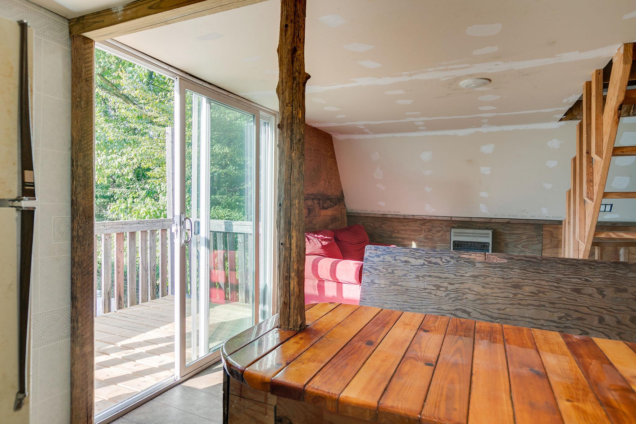 6572 Hassell Creek Road Lyles, TN 37098 - Photo 18 of 29 a view of a living room and floor to ceiling window