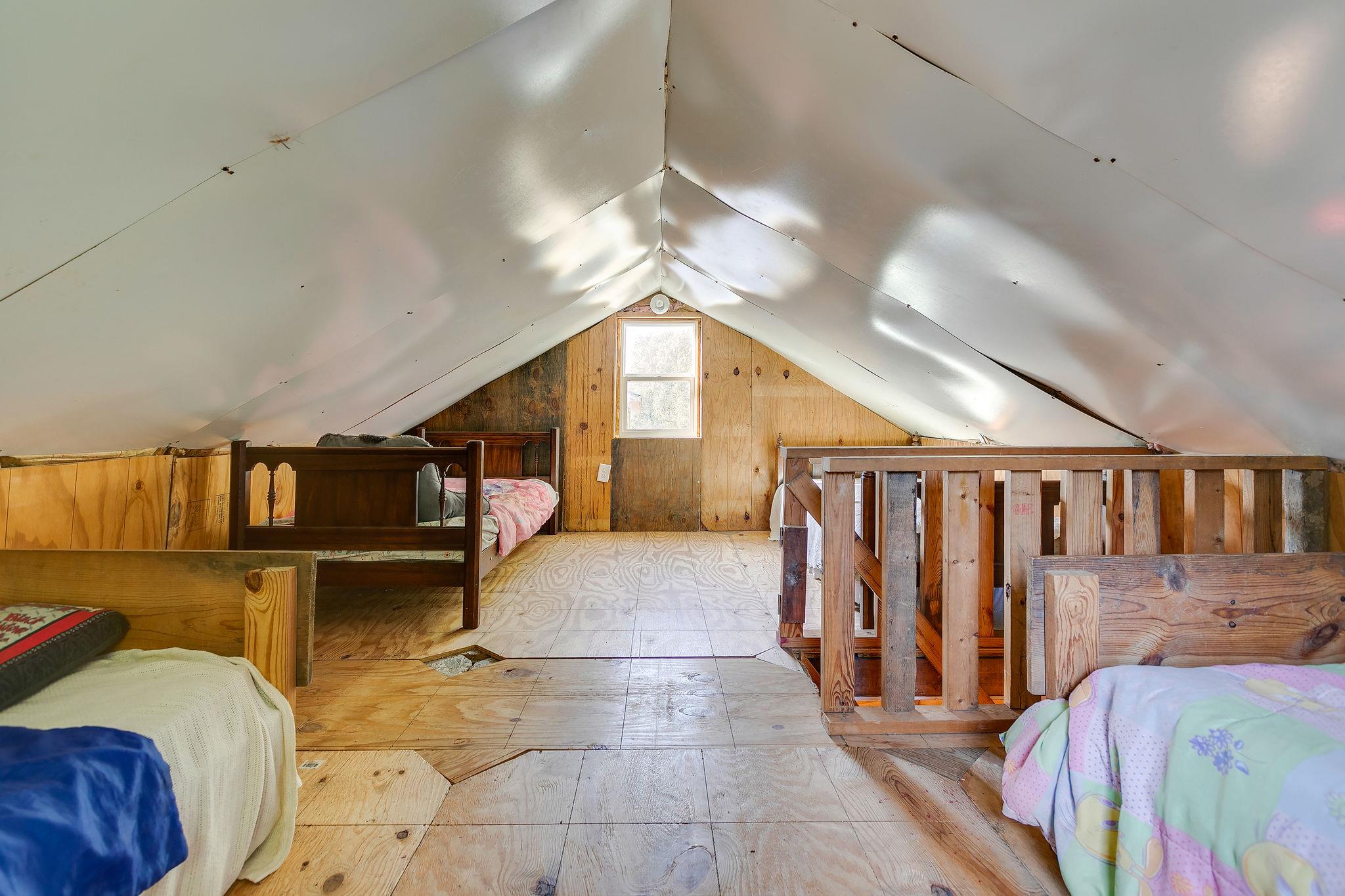 6572 Hassell Creek Road Lyles, TN 37098 - Photo 21 of 29 a spacious bedroom with a bed and a chandelier