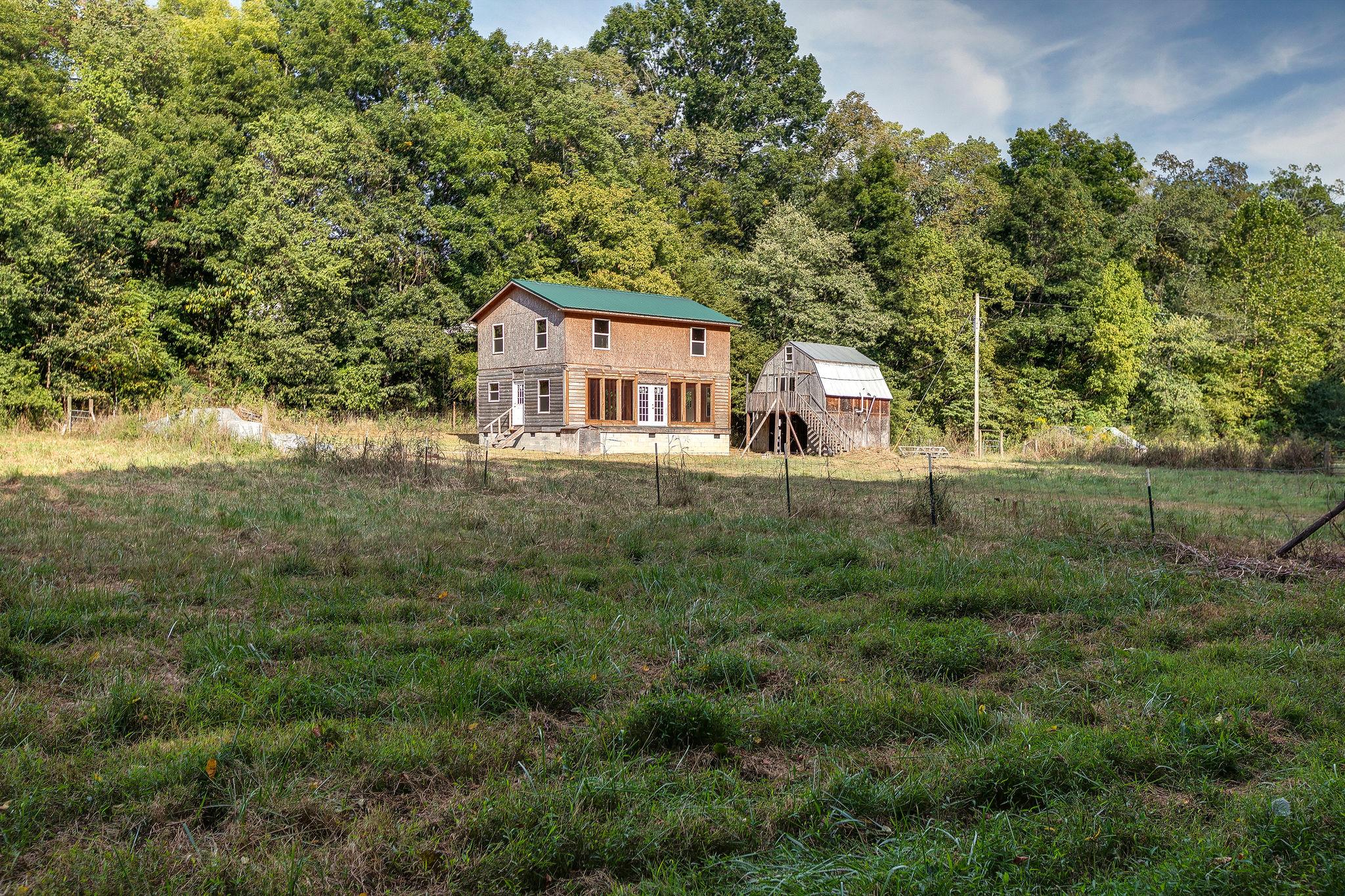 6572 Hassell Creek Road Lyles, TN 37098 - Photo 26 of 29 an outdoor view of house with green space