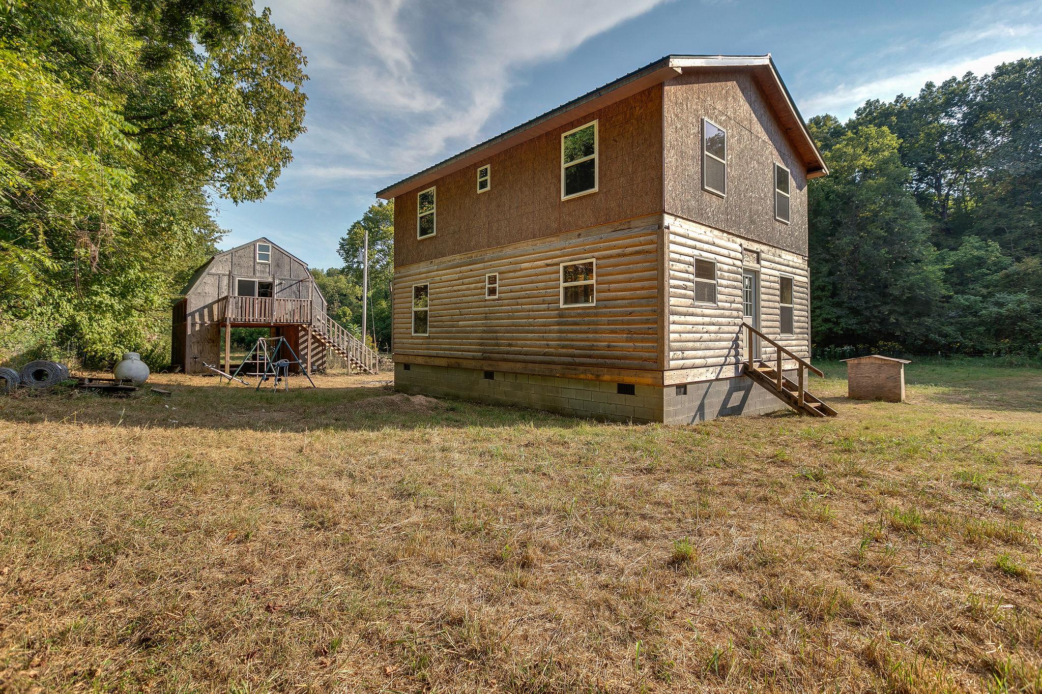 6572 Hassell Creek Road Lyles, TN 37098 - Photo 27 of 29 a front view of a house with a yard