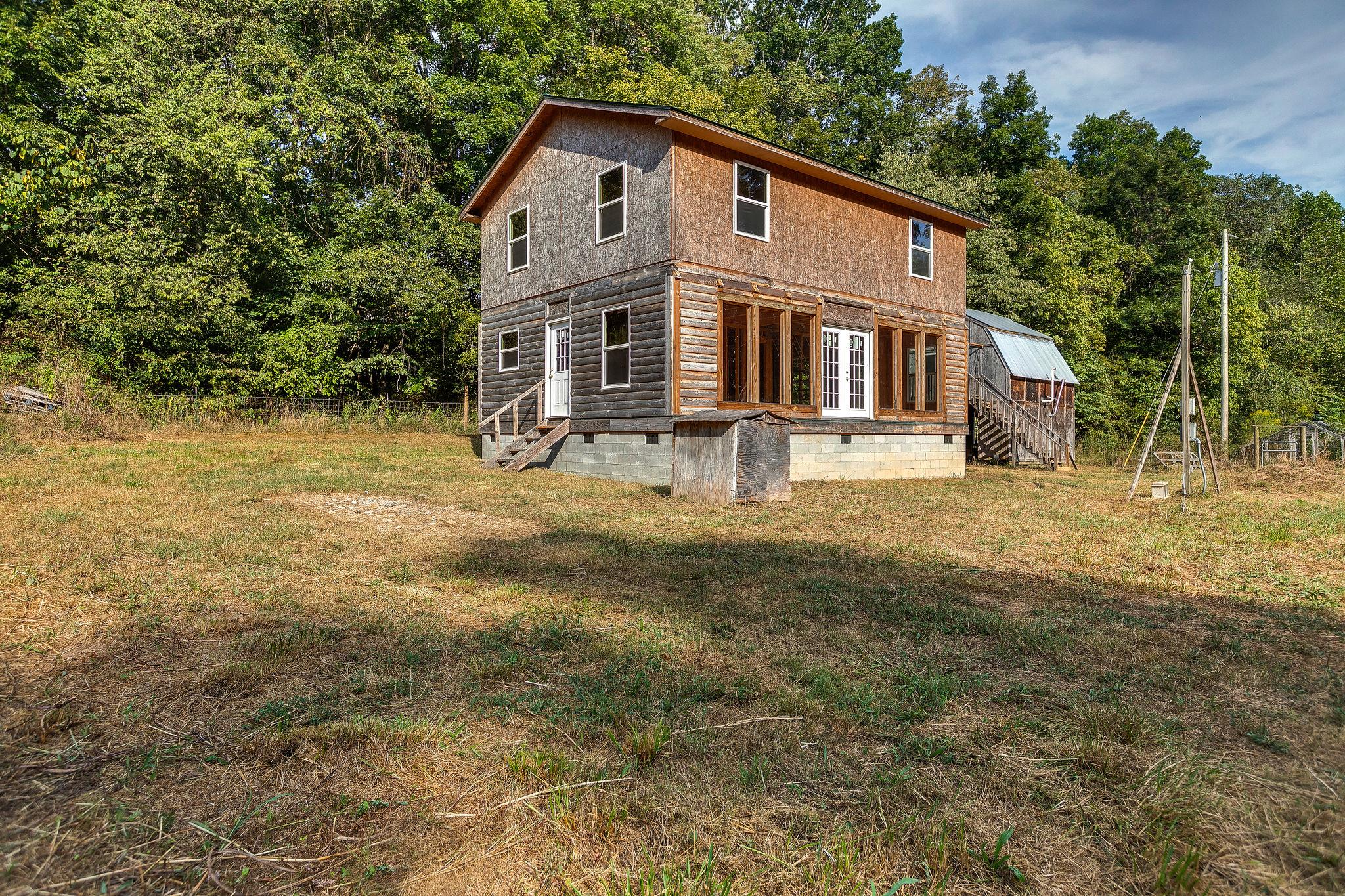 6572 Hassell Creek Road Lyles, TN 37098 - Photo 4 of 29 a view of a yard with large trees