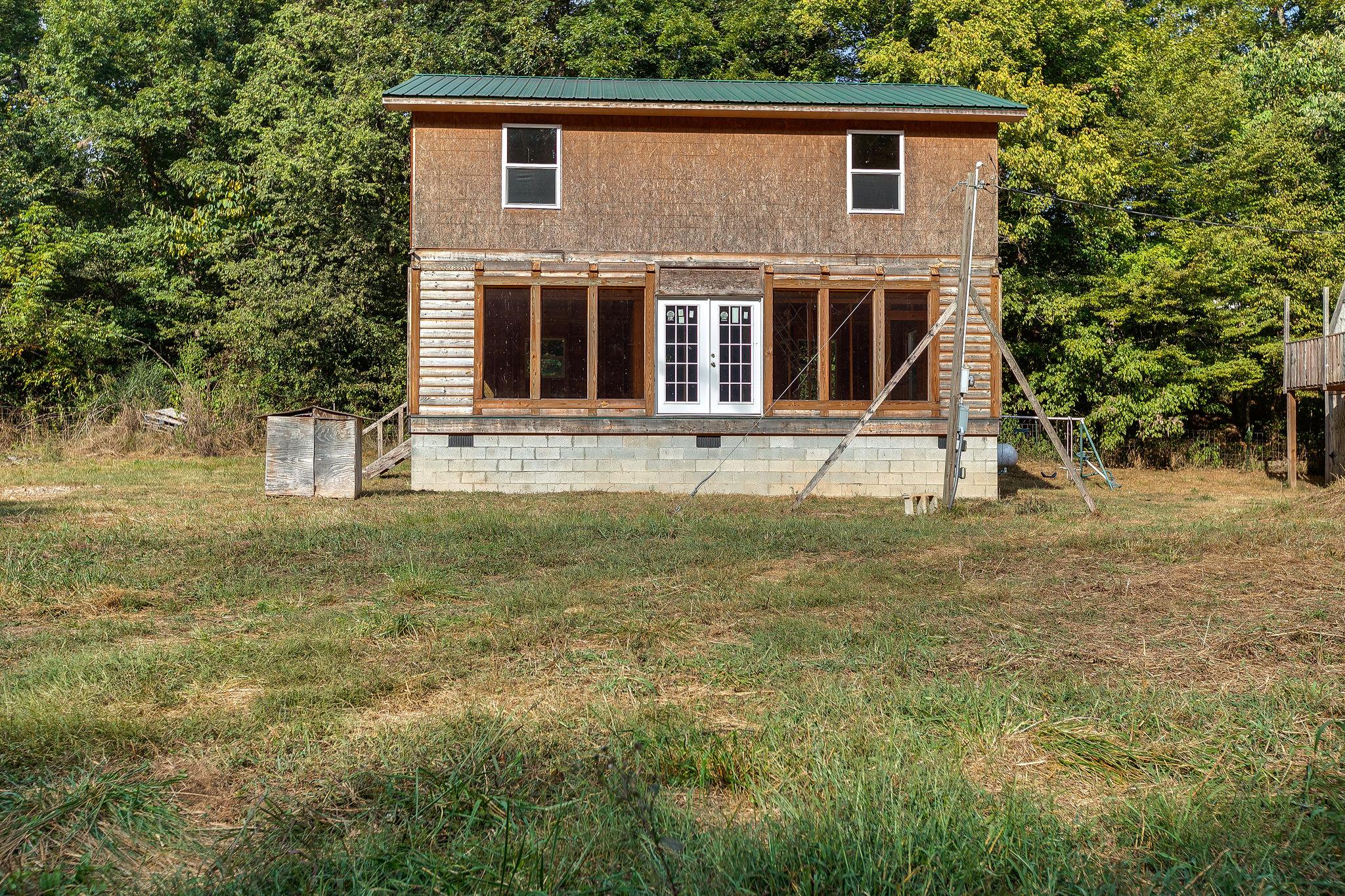 6572 Hassell Creek Road Lyles, TN 37098 - Photo 5 of 29 a house with yard in front of it