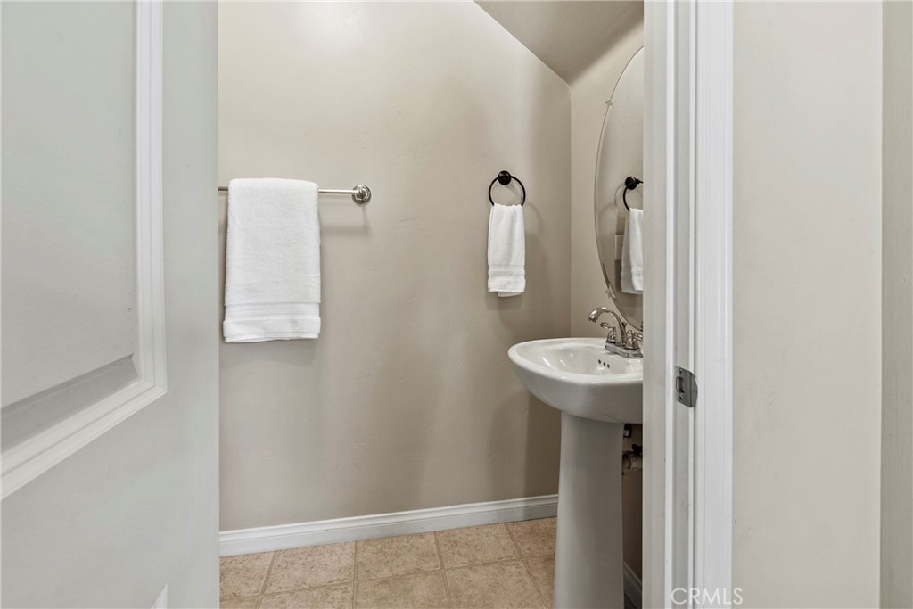 263 Spruce Street, Unit B Arroyo Grande, CA 93420 - Photo 12 of 36 a bathroom with a sink and mirror