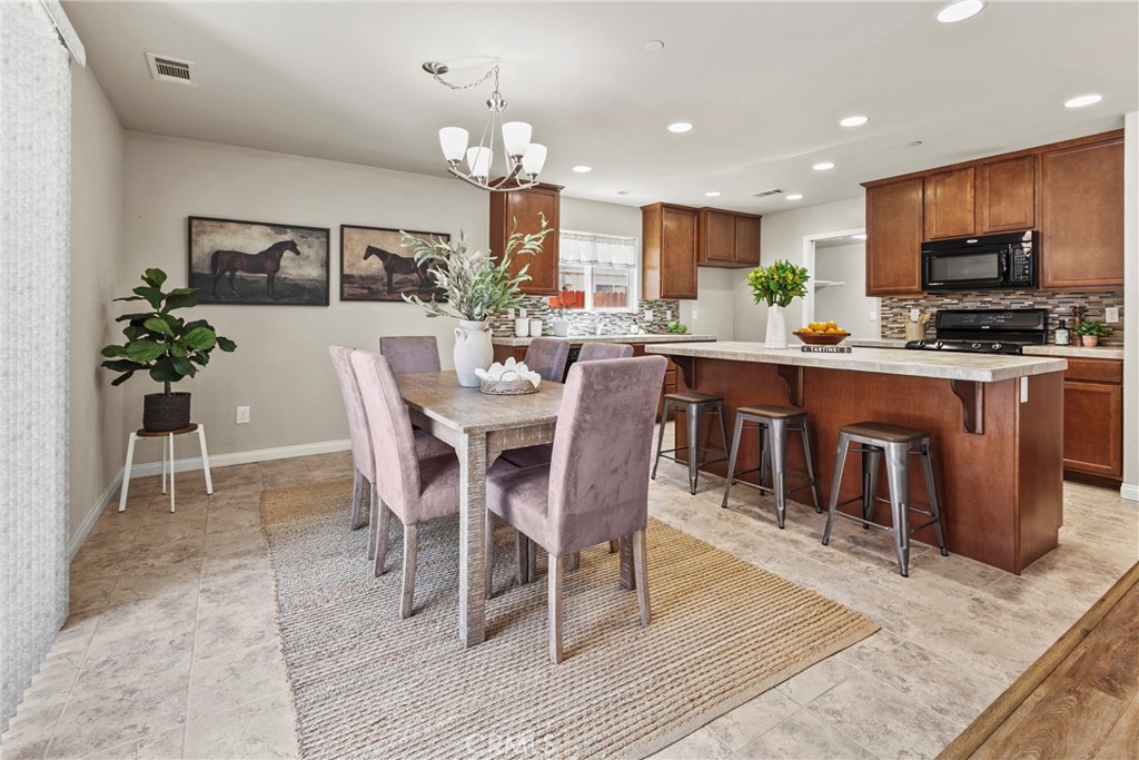 263 Spruce Street, Unit B Arroyo Grande, CA 93420 - Photo 15 of 36 a large kitchen with cabinets table and chairs