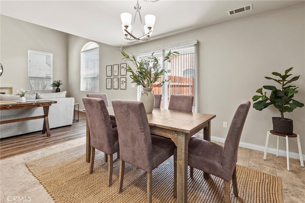 263 Spruce Street, Unit B Arroyo Grande, CA 93420 - Photo 16 of 36 a view of a dining room with furniture and chandelier