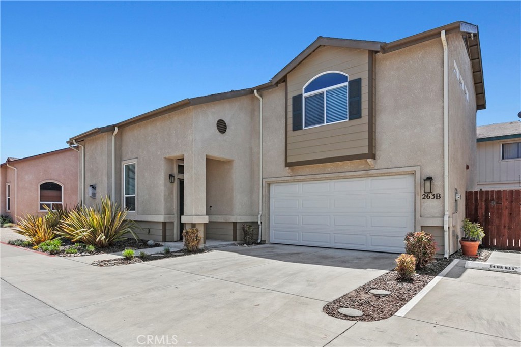 263 Spruce Street, Unit B Arroyo Grande, CA 93420 - Photo 2 of 36 a front view of a house with garage