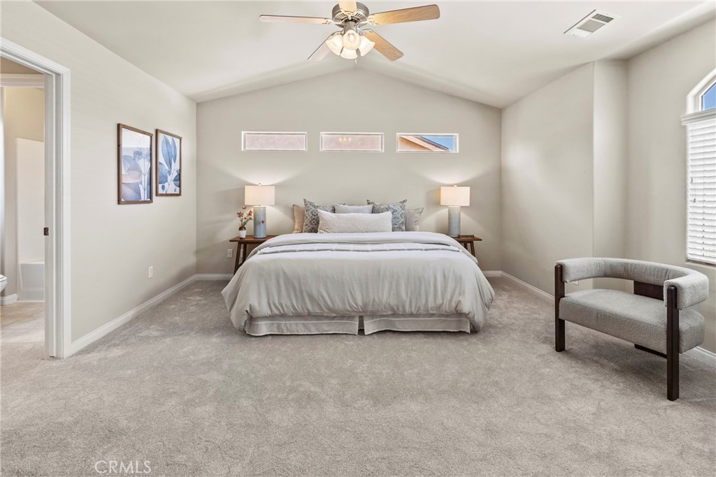 263 Spruce Street, Unit B Arroyo Grande, CA 93420 - Photo 24 of 36 a bedroom with a bed and a couch