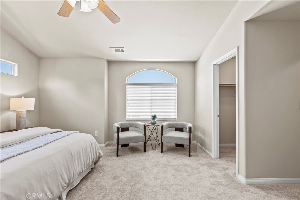 263 Spruce Street, Unit B Arroyo Grande, CA 93420 - Photo 25 of 36 a bed room with a bed and a chair