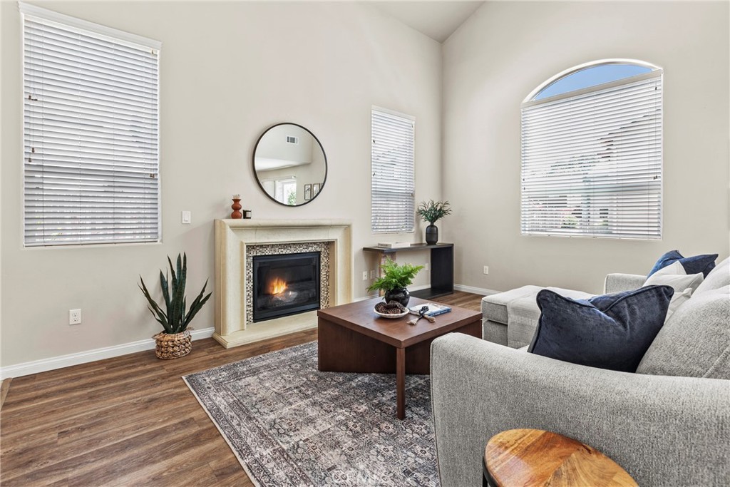 263 Spruce Street, Unit B Arroyo Grande, CA 93420 - Photo 5 of 36 a living room with furniture a fireplace a window and a window