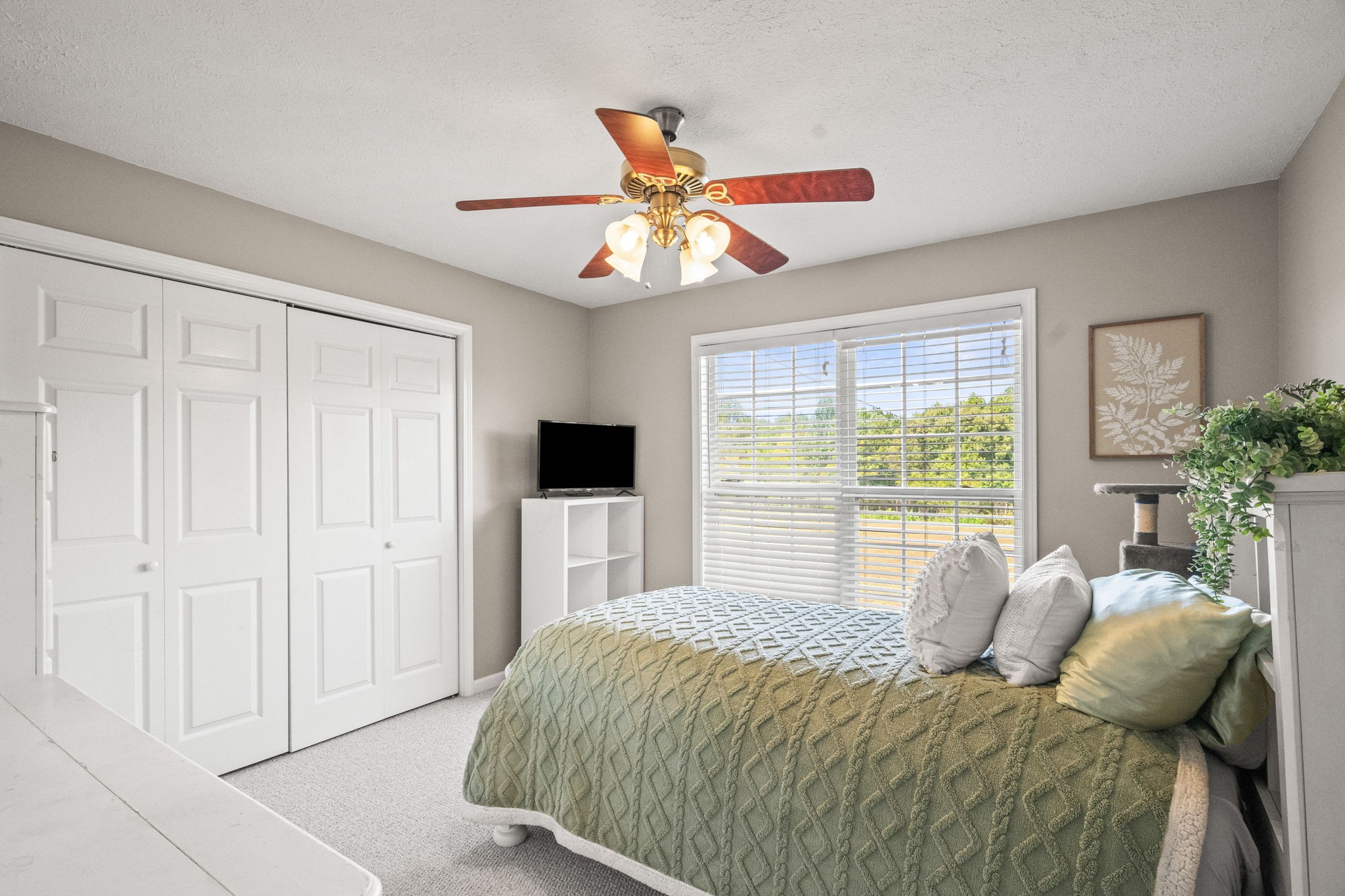 1051 Jacob's Valley Road Joelton, TN 37080 - Photo 18 of 45 a bedroom with a bed and a chandelier