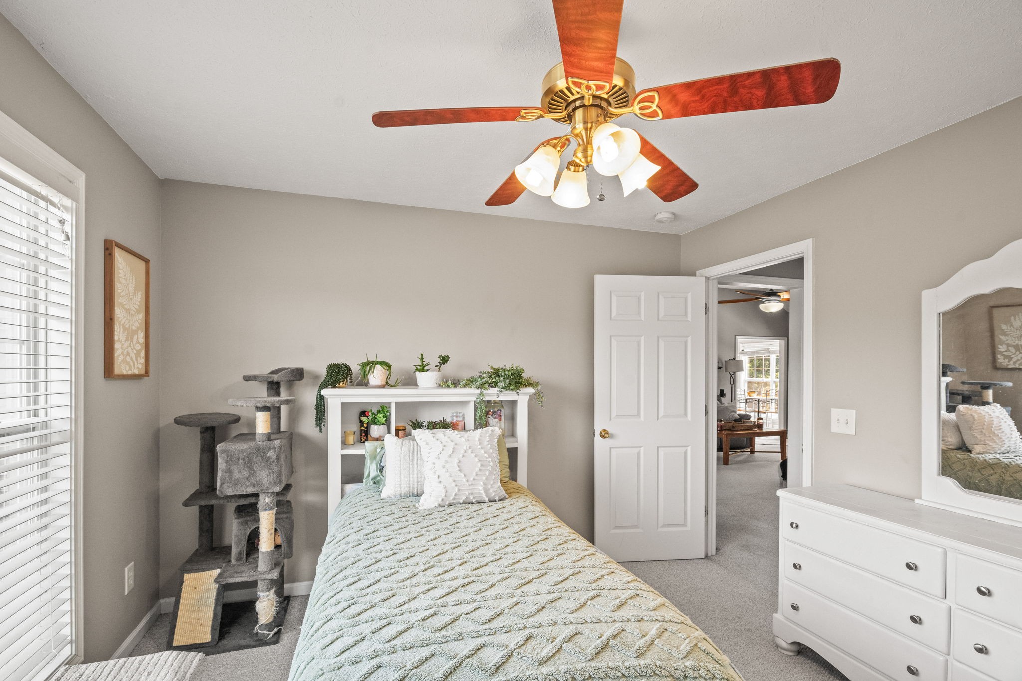 1051 Jacob's Valley Road Joelton, TN 37080 - Photo 19 of 45 a bedroom with a bed and a chandelier