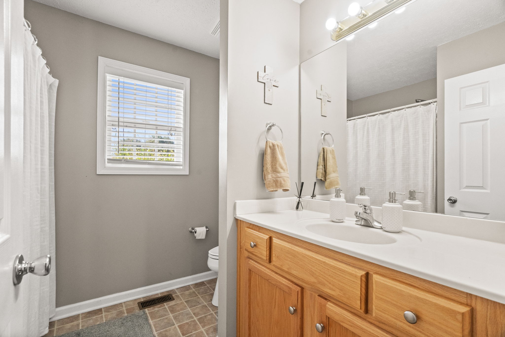 1051 Jacob's Valley Road Joelton, TN 37080 - Photo 21 of 45 a bathroom with a sink and a mirror