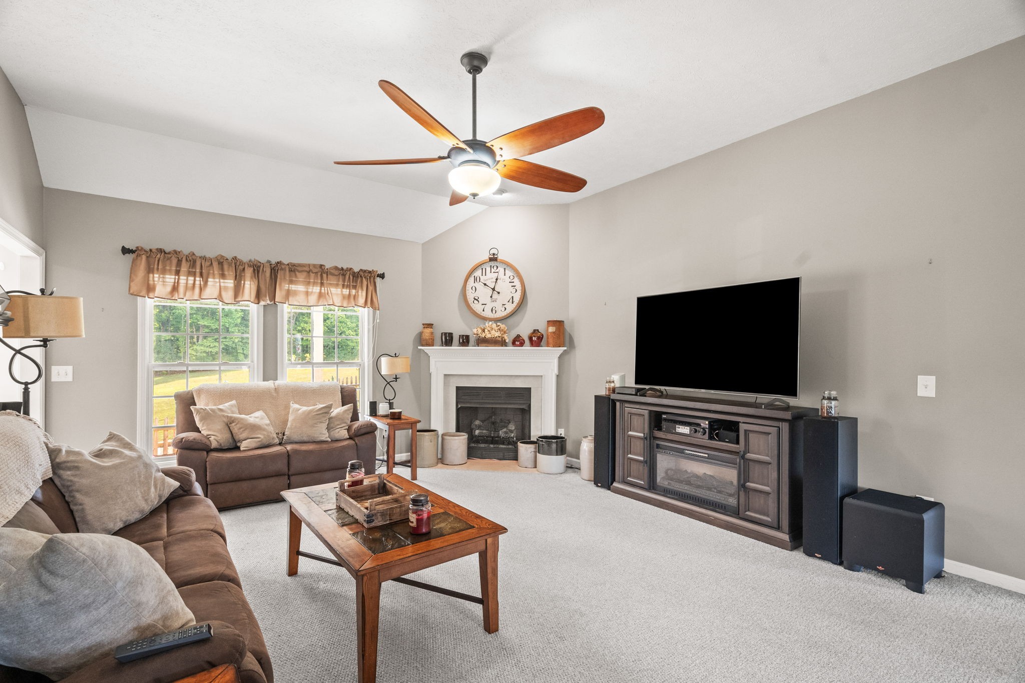 1051 Jacob's Valley Road Joelton, TN 37080 - Photo 3 of 45 a living room with furniture a fireplace and a flat screen tv