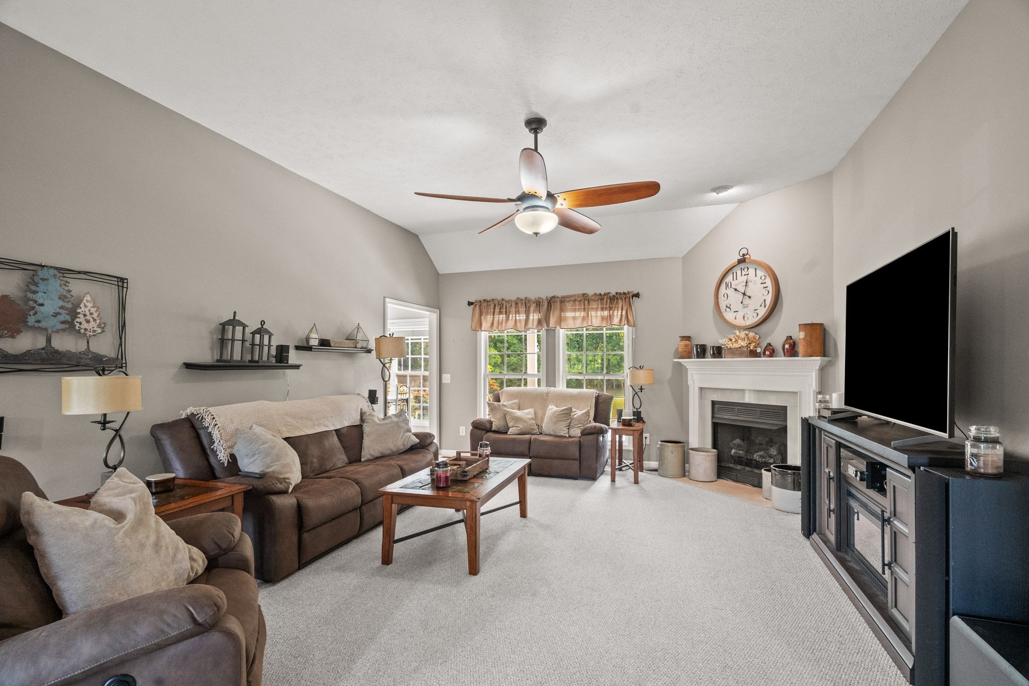 1051 Jacob's Valley Road Joelton, TN 37080 - Photo 4 of 45 a living room with furniture a fireplace and a flat screen tv