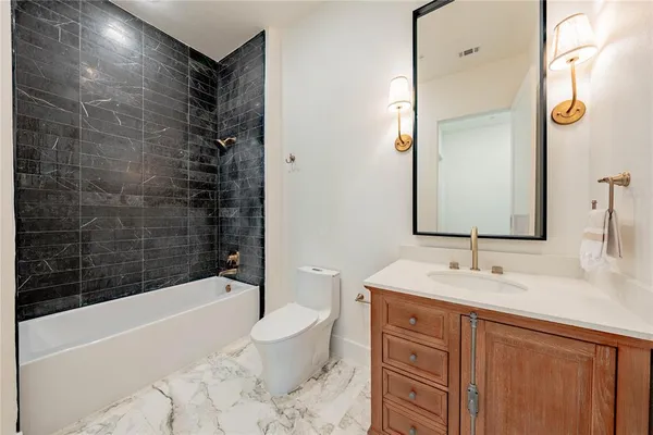 a bathroom with a double vanity sink mirror and double