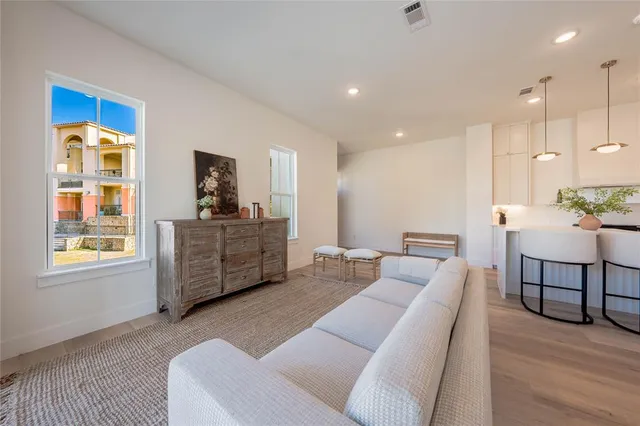a kitchen with a sink stove and a refrigerator