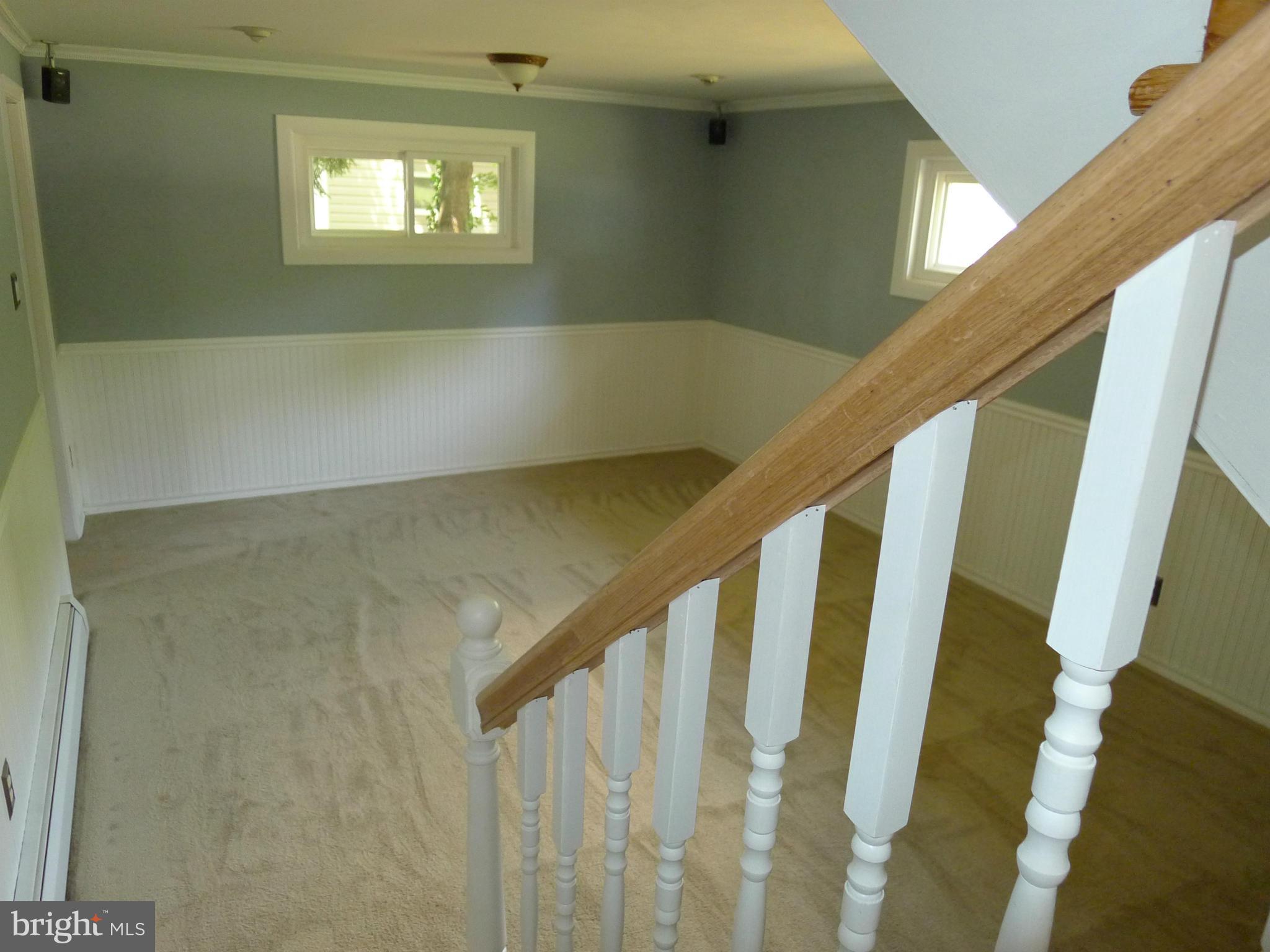 6302 Climbhill Road Alexandria, VA 22310 - Photo 13 of 30 Wooden Banisters lead to Rec Room