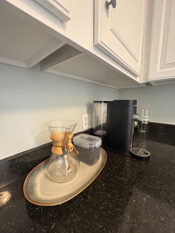 18 Emerald Avenue, Unit 2 Webster, MA 01570 - Photo 11 of 26 a bathroom with a sink and a mirror