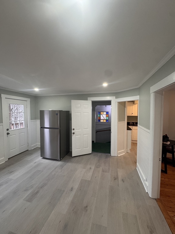 18 Emerald Avenue, Unit 2 Webster, MA 01570 - Photo 15 of 26 a view of a kitchen with a sink and a refrigerator