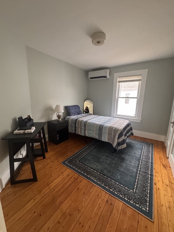 18 Emerald Avenue, Unit 2 Webster, MA 01570 - Photo 19 of 26 a living room with a bed furniture and a window