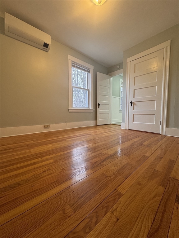 18 Emerald Avenue, Unit 2 Webster, MA 01570 - Photo 22 of 26 a view of a room with wooden floor and window