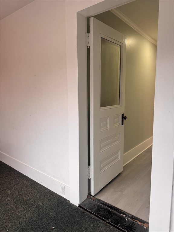18 Emerald Avenue, Unit 2 Webster, MA 01570 - Photo 24 of 26 a view of a hallway