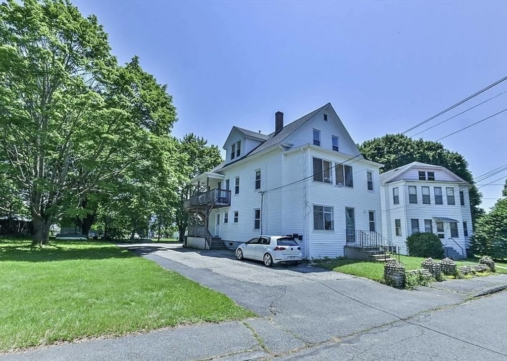 18 Emerald Avenue, Unit 2 Webster, MA 01570 - Photo 26 of 26 a front view of a house with a yard