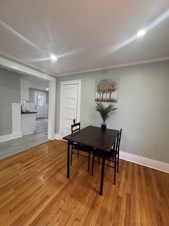 18 Emerald Avenue, Unit 2 Webster, MA 01570 - Photo 4 of 26 a view of a workspace with furniture and wooden floor