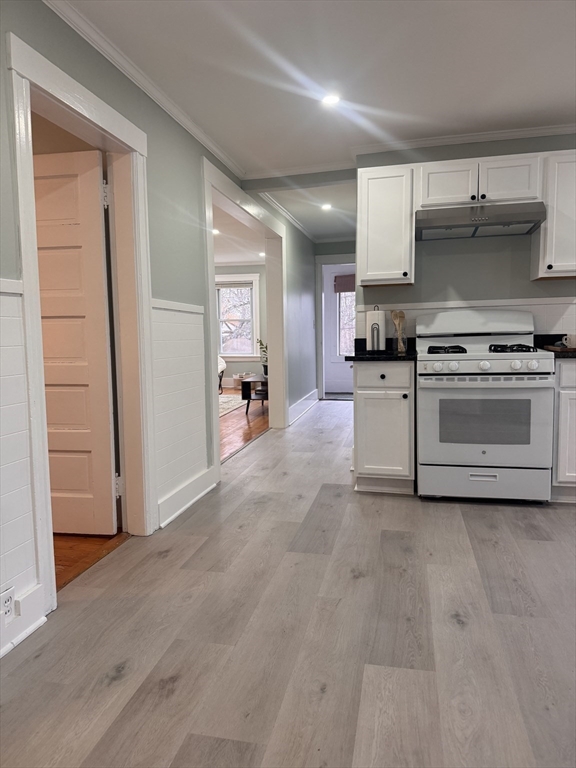 18 Emerald Avenue, Unit 2 Webster, MA 01570 - Photo 7 of 26 a kitchen with stainless steel appliances a stove a sink and a refrigerator