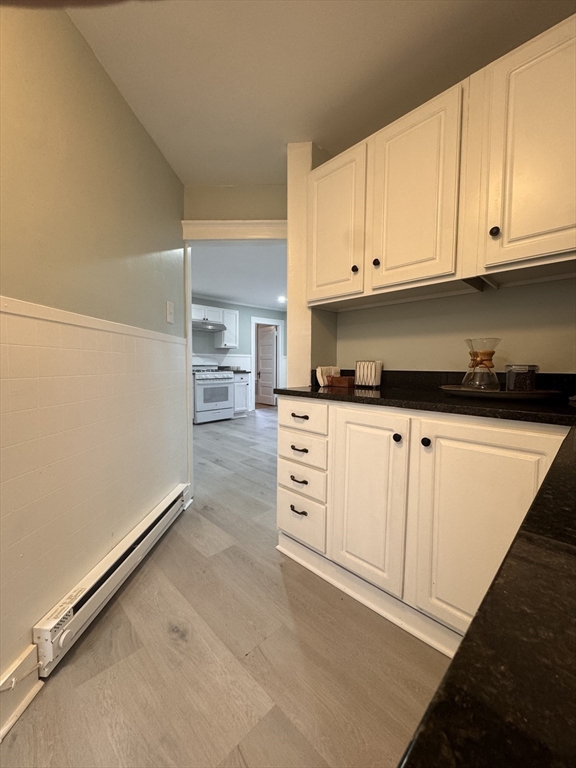 18 Emerald Avenue, Unit 2 Webster, MA 01570 - Photo 10 of 26 a kitchen with cabinets and appliances
