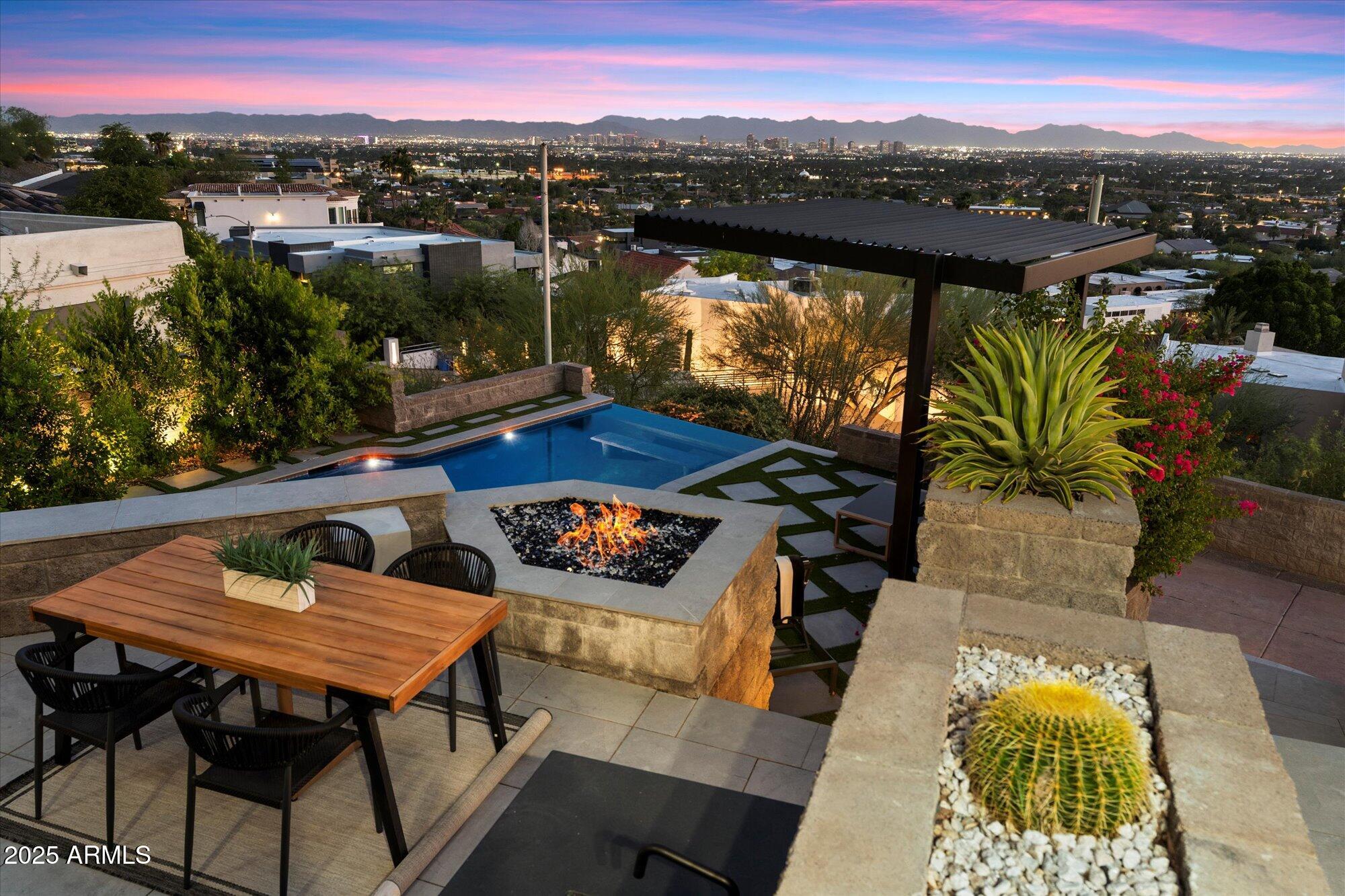 7147 North 23rd Place Phoenix, AZ 85016 - Photo 11 of 103 a view of a balcony with chairs and a potted plant