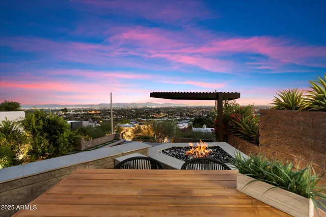 a living room with furniture a flat screen tv and a floor to ceiling window