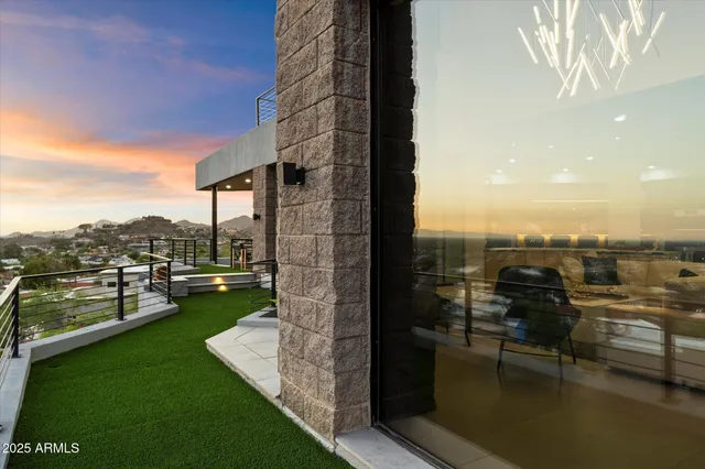 a living room with fireplace furniture and a flat screen tv