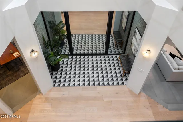 a outdoor living space with furniture and a floor to ceiling window