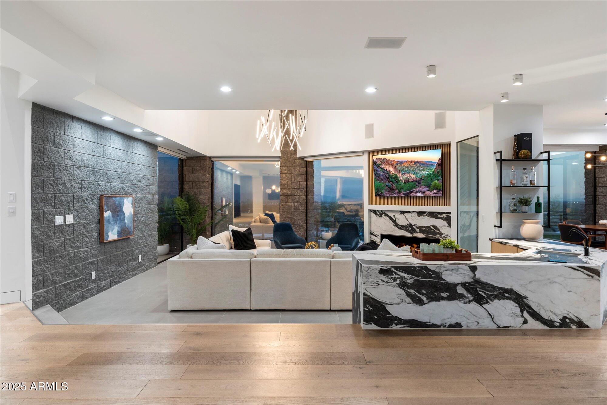 7147 North 23rd Place Phoenix, AZ 85016 - Photo 27 of 103 a living room with furniture and a flat screen tv