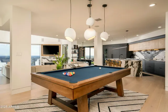 a bedroom with a bed and large glass window