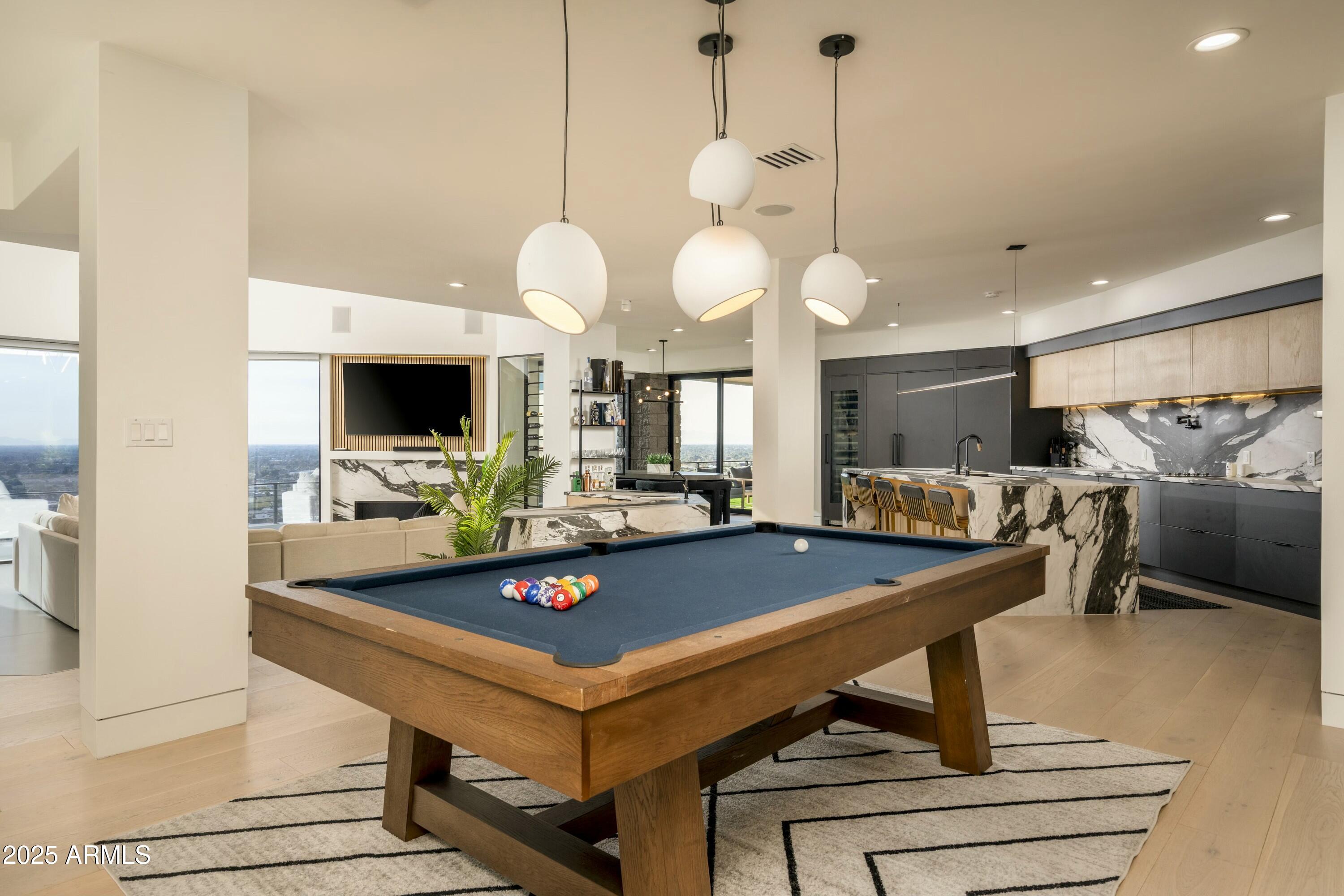 7147 North 23rd Place Phoenix, AZ 85016 - Photo 32 of 103 a room with pool table and flat screen tv