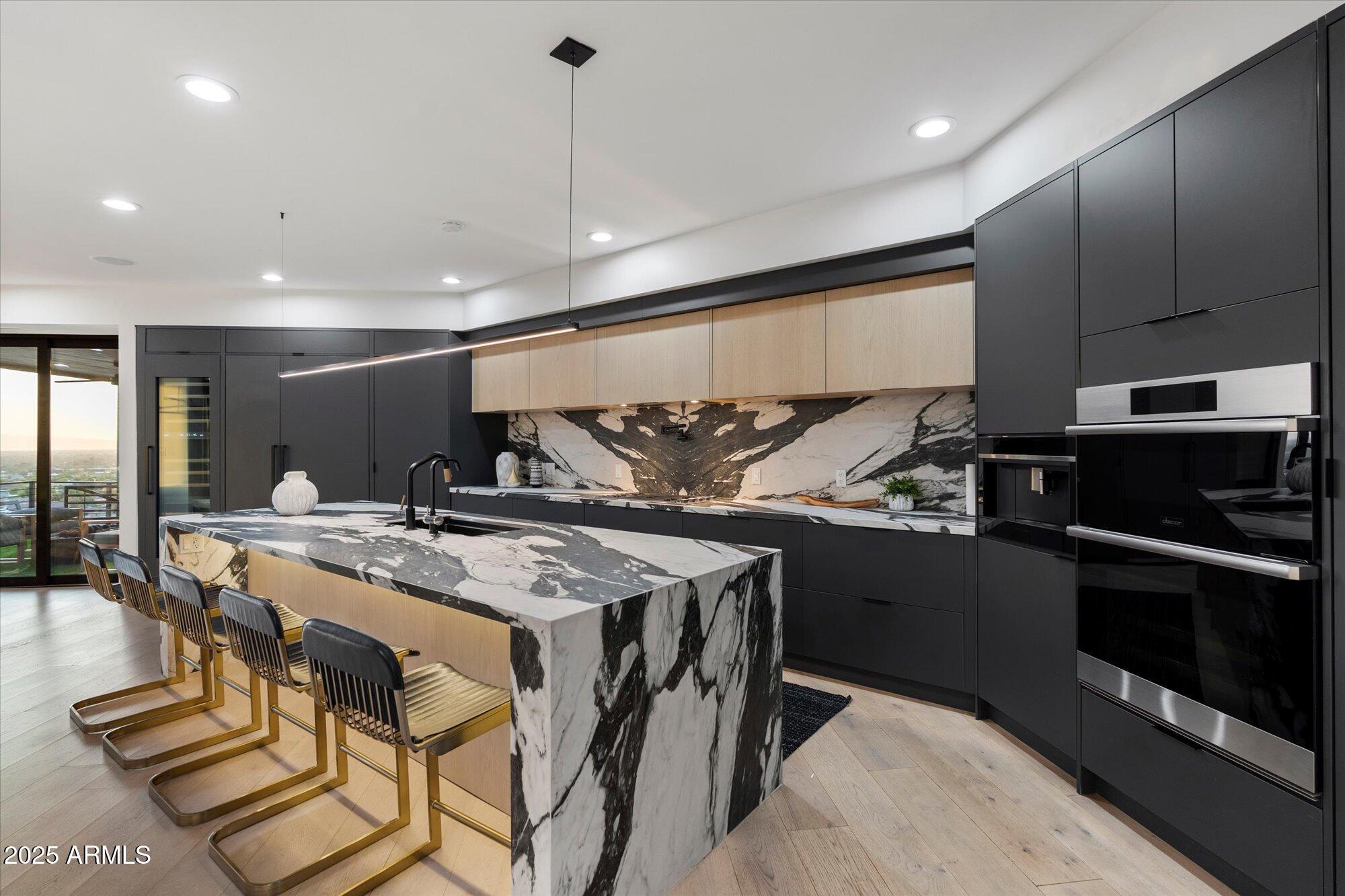 7147 North 23rd Place Phoenix, AZ 85016 - Photo 36 of 103 a kitchen with a table and chairs in it