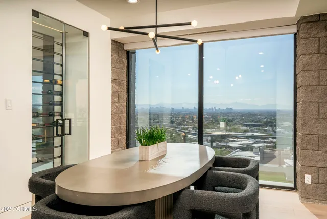 a bedroom with a large bed and a large window